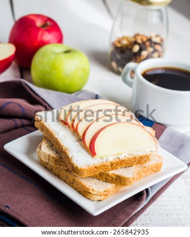 toast with cheese curd, honey and apple, a cup of coffee, a healthy breakfast