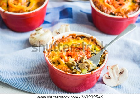 Baked mushroom julienne potatoes with cheese, vegetarian lunch on a white background