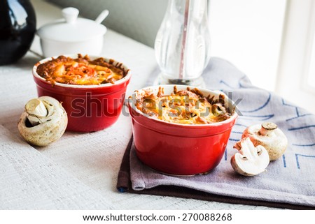 Baked mushroom julienne with cheese, vegetarian lunch on a white background