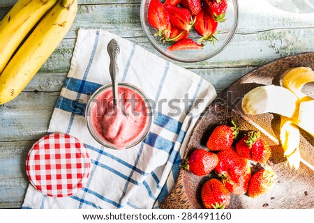 strawberry-banana ice cream in a glass fruit dessert, summer, clean eating,top view, raw banana