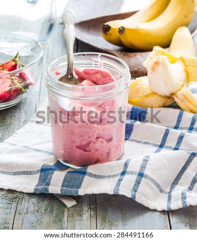 strawberry-banana ice cream in a glass, healthy dessert, summer,selective focus