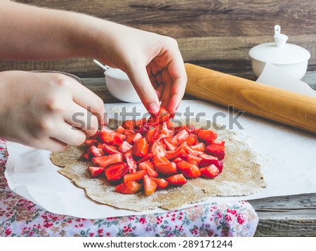 cooking processes biscuit with fresh strawberries, vegan dessert, clean eating, tone
