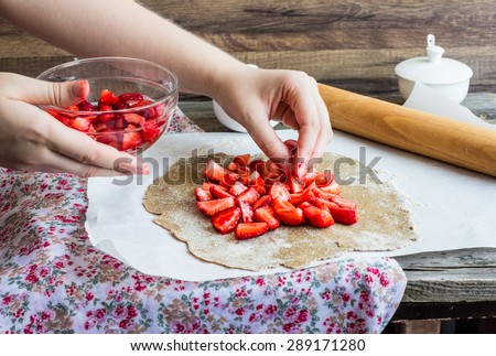 cooking processes rye and bran biscuit with fresh strawberries, vegan dessert, clean eating,pie