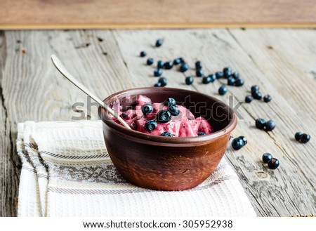 banana ice cream with blueberries, healthy dessert, vegan, rustic background