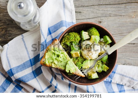 Winter vegetable salad with broccoli and cauliflower, toast with avocado, vegan lunch
