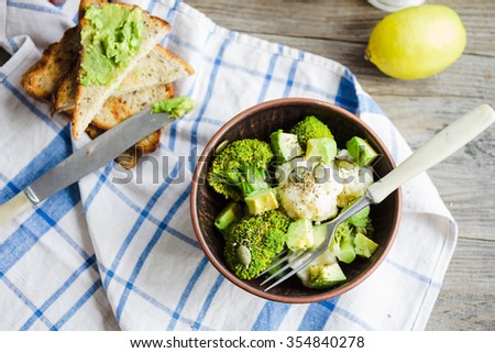 Winter vegetable salad with broccoli and cauliflower, toast with avocado,vegan lunch,top view