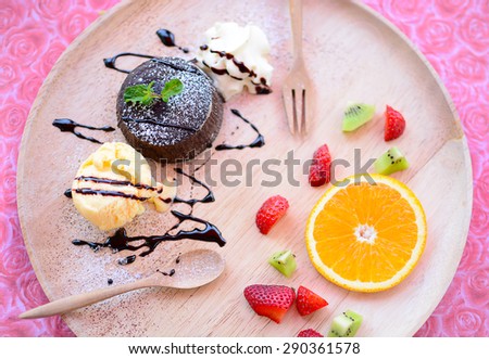 Chocolate Lava Cake with ice cream and orange strawberry fruit