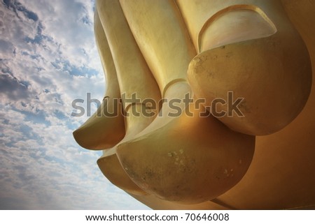 gold finger of image of Buddha