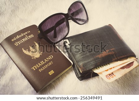 Preparation for travel, sunglasses, money, passport ,vintage style