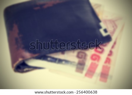 Wallet and Thai bank notes vintage style, Image blur