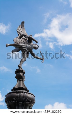statue of flying cupid using his bow at public park in Bangkok, Thailand