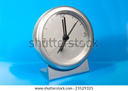 Simple gray desk clock (on a bright blue background)