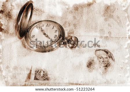 Antique pocket watch and a dollar bill covered by sand (Time is Money concept, vintage style)