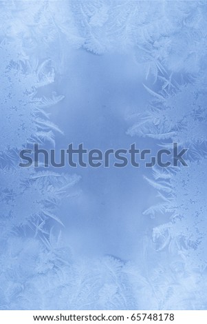 Slightly blurred frost pattern on a window glass (with empty space for your text or image)
