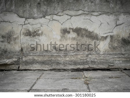 Crack Concrete wall with brick stone street road, background