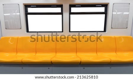 Yellow chair and windows in electric train