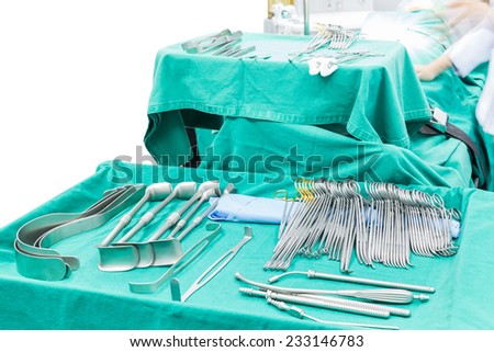 Surgical tools displayed on a surgical tray who need to oparate a patient in an operation room in a modern hospital, isolated on white background with clipping path