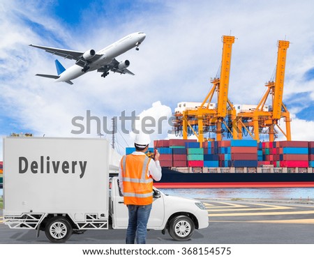 Port engineer talking on the walkie-talkie for controlling loading container with delivery cargo truck and cargo plane flying above the harbor for logistic concept