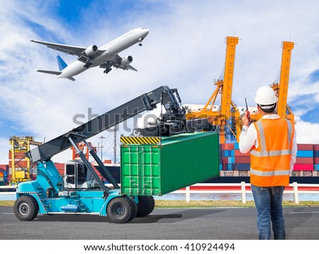 Dock worker talking with radio for controlling loading container in an industrial harbor with loading crane lifts container and cargo plane flying above ship port for logistic import export concept