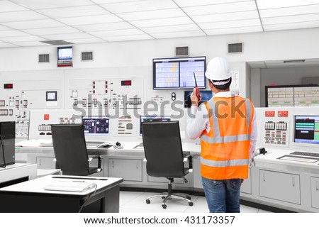 Electrical engineer working at control room of a modern thermal power plant