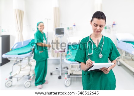 Nurse writing a medical record in the hospital room