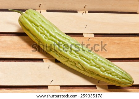 Bitter melon in wooden crate