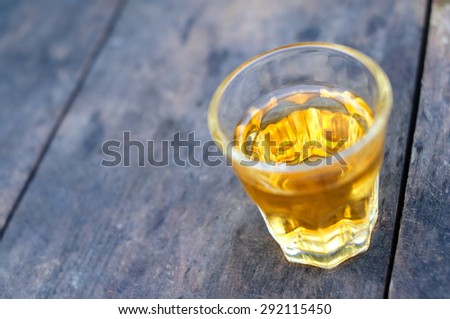 Small shot glass of alcoholic beverage
