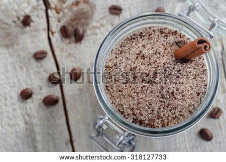 Homemade scrub made of sugar, ground coffee and cinnamon powder (top view)