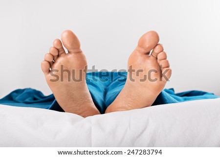 Resting women feet isolated on a white background