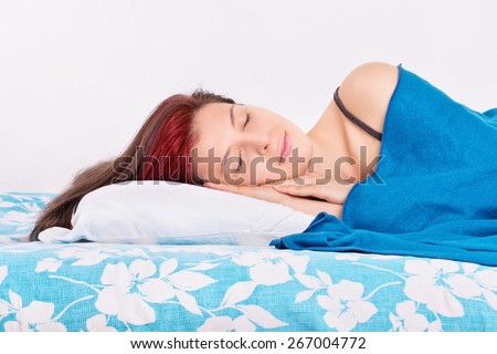 Good sleep is very important. Young girl sleeping in her bed