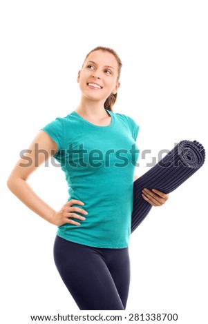 Going out for fitness exercise. Young girl wearing exercise mat isolated on white background