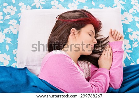 Sweet dreams. Young girl sleeping in her bed.