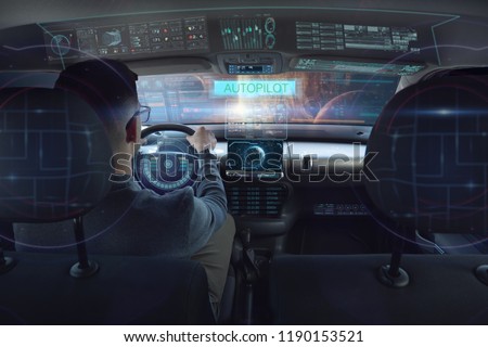 in a futuristic world a person drives a car of the future with holographic technology and augmented reality, concept of transportation and immersive technology linked to travel,  cars withAutopilot
