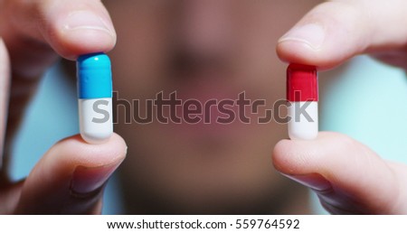 hand of a hospital medical expert shows the pill to be taken to his patient. concept of generical pills