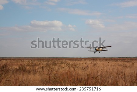 The old plane against the cloudy sky