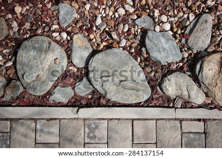 Texture of stones and crushed stone on sawdust background