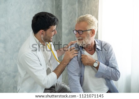 An old patient is consulting to a young doctor about his backache symptom