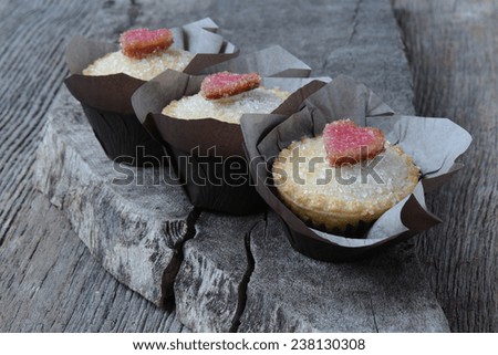 Black Berry Pie Cupcakes with Heart and Sugar Topping on Dark Wood Background