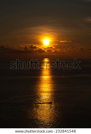 Boat in The Middle of The sea at Sunset Time