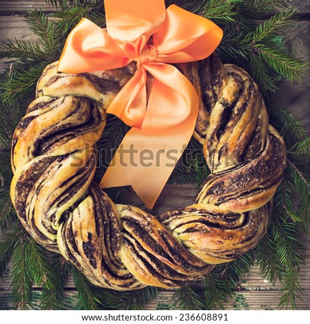 saffron and cinnamon bread wreath, top view, square image, toned