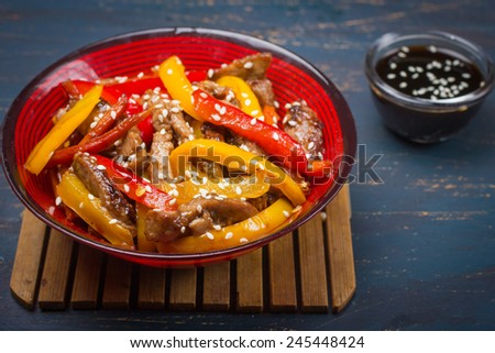 Stir fry pork and vegetables with sesame seeds and soy sauce