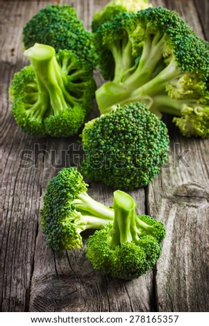 fresh organic broccoli on a wooden background