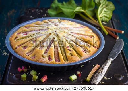 Rhubarb cake on dark background
