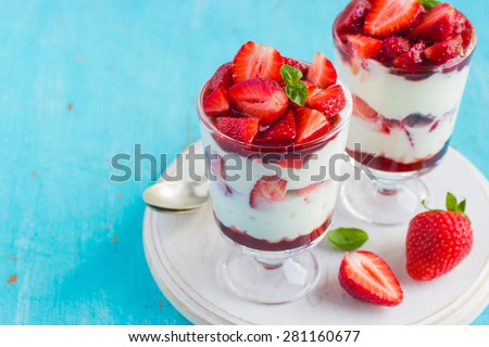 homemade dessert with fresh strawberry,  cream cheese and strawberry  jam on glasses