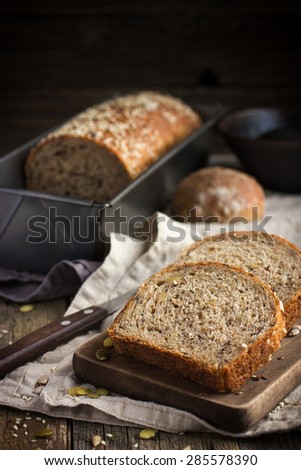 freshly baked  multigrain bread on rustic background