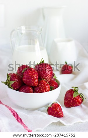 fresh strawberry and milk on white  background