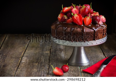chocolate cake with  fresh strawberry on rustic  background
