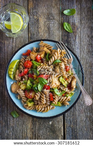 Whole wheat pasta  with chicken and vegetables, top view