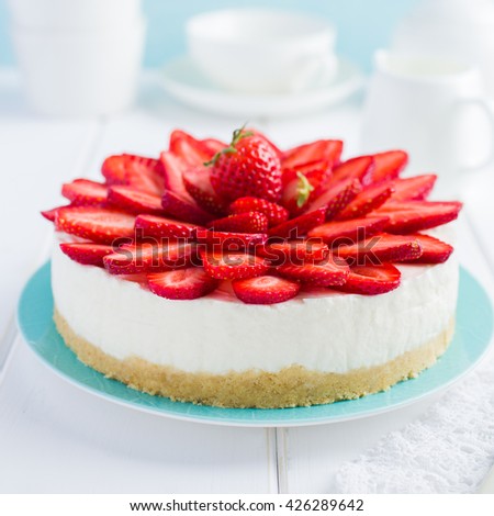 no baked strawberry cheesecake on white background, selective focus, square image