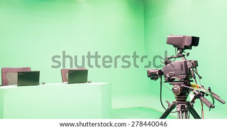 Television studio with camera and lights - camera on tripod